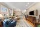 Bright living room featuring hardwood floors, decorative rug, and comfortable seating area at 1316 North Ne Ave, Atlanta, GA 30307