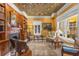 Bright living room with fireplace, built-in bookshelves, complemented by a decorative ceiling and natural light at 1316 North Ne Ave, Atlanta, GA 30307