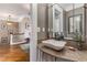 Elegant powder room featuring a vessel sink, decorative mirror, and hardwood floors at 1316 North Ne Ave, Atlanta, GA 30307