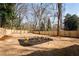 Spacious backyard with a newly landscaped area and wooden fence at 17 Rockyford Ne Rd, Atlanta, GA 30317