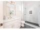 Contemporary bathroom with walk-in shower and white vanity at 17 Rockyford Ne Rd, Atlanta, GA 30317