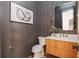 Modern powder room with wood vanity and sleek fixtures at 17 Rockyford Ne Rd, Atlanta, GA 30317