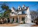 Two-story farmhouse features a front porch, and a neutral color scheme at 17 Rockyford Ne Rd, Atlanta, GA 30317