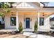 Inviting front porch with wooden ceiling and blue door at 17 Rockyford Ne Rd, Atlanta, GA 30317