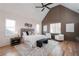 Spacious main bedroom with vaulted ceiling, wood floors, and stylish decor at 17 Rockyford Ne Rd, Atlanta, GA 30317