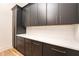 Spacious pantry with dark cabinets and quartz countertops at 17 Rockyford Ne Rd, Atlanta, GA 30317