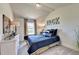 Bedroom with a blue comforter, white dresser, and wood nightstand at 1934 Asher Ln # 060, Conyers, GA 30013