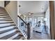 Modern staircase leading to upper level; view of living area at 1934 Asher Ln # 060, Conyers, GA 30013