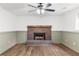 Finished basement room with brick fireplace at 2010 Sturbridge Ln, Buford, GA 30519