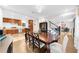 Spacious dining room with hardwood floors and view into kitchen at 2010 Sturbridge Ln, Buford, GA 30519