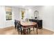 Formal dining room featuring hardwood floors and large windows at 2010 Sturbridge Ln, Buford, GA 30519