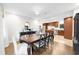 Elegant dining room with a large table and hardwood floors at 2010 Sturbridge Ln, Buford, GA 30519