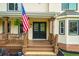 Inviting front porch with double doors and hanging plants at 2010 Sturbridge Ln, Buford, GA 30519