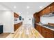 Modern kitchen with hardwood floors and stainless steel appliances at 2010 Sturbridge Ln, Buford, GA 30519