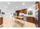 Modern kitchen with stainless steel appliances and butcher block island at 2010 Sturbridge Ln, Buford, GA 30519