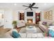 Cozy living room with a fireplace and built-in shelving at 2010 Sturbridge Ln, Buford, GA 30519