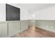 Bright living room with wood-look floors and wainscoting at 2010 Sturbridge Ln, Buford, GA 30519