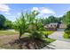 Residential neighborhood with mature trees and brick home at 2010 Sturbridge Ln, Buford, GA 30519