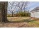 Backyard featuring new wooden fence, large tree, and an open yard at 161 Adair Se Ave, Atlanta, GA 30315