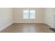 Empty bedroom featuring a window, white trim and neutral walls at 161 Adair Se Ave, Atlanta, GA 30315