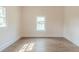 Bright bedroom featuring new hardwood floors and fresh paint at 161 Adair Se Ave, Atlanta, GA 30315
