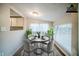 Bright dining area with a round table, stylish chairs, and large windows for natural light at 161 Adair Se Ave, Atlanta, GA 30315