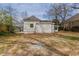 Back exterior of a home with ample yard space and partial wooden fence at 161 Adair Se Ave, Atlanta, GA 30315