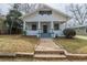 Charming one-story home featuring a covered front porch and a well-maintained yard and front steps at 161 Adair Se Ave, Atlanta, GA 30315