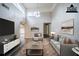 Bright living room, staged, with a large window, hardwood floors, and neutral furniture at 161 Adair Se Ave, Atlanta, GA 30315