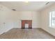 Cozy living room featuring fresh paint, a fireplace, and luxury vinyl plank flooring throughout at 161 Adair Se Ave, Atlanta, GA 30315