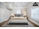 Staged primary bedroom featuring a large bed, neutral tones, and natural light at 161 Adair Se Ave, Atlanta, GA 30315