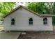 Side view of a cozy one-story home featuring bright windows and neat landscaping at 2064 Chicago Nw Ave, Atlanta, GA 30314