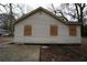 Rear view of renovated cottage, showing new siding at 2064 Chicago Nw Ave, Atlanta, GA 30314