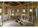 Partially remodeled interior featuring open spaces, exposed framing, new flooring, and updated utilities at 2064 Chicago Nw Ave, Atlanta, GA 30314