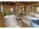 Interior view of a home under construction featuring exposed framing, new subfloors, and updated utilities at 2064 Chicago Nw Ave, Atlanta, GA 30314