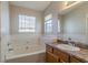 Bathroom with a bathtub, vanity, and window at 2675 Park Ave, Austell, GA 30106