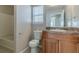 Bathroom with wood vanity, single sink, and bathtub shower combo at 2675 Park Ave, Austell, GA 30106