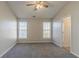 Well-lit bedroom with two large windows and ceiling fan at 2675 Park Ave, Austell, GA 30106