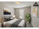 Virtually staged bedroom with large bed and window at 2675 Park Ave, Austell, GA 30106