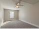 Spacious bedroom with ceiling fan and neutral wall colors at 2675 Park Ave, Austell, GA 30106