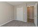 Bedroom with grey carpet, double-door closet, and access to hallway at 2675 Park Ave, Austell, GA 30106