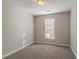 Bedroom with grey carpet, window, and neutral wall color at 2675 Park Ave, Austell, GA 30106