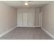 Bright bedroom featuring a ceiling fan and ample closet space at 2675 Park Ave, Austell, GA 30106