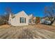 Tan house with black shutters and a large driveway at 2675 Park Ave, Austell, GA 30106