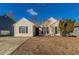 Beige house with black shutters, a driveway, and landscaping at 2675 Park Ave, Austell, GA 30106