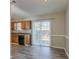 Eat-in kitchen with wood cabinets, tile floor, and sliding glass door to patio at 2675 Park Ave, Austell, GA 30106