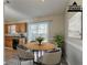 Virtually staged kitchen with dining area and sliding door at 2675 Park Ave, Austell, GA 30106