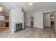 Living room with fireplace and kitchen view at 2675 Park Ave, Austell, GA 30106