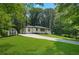 Cute ranch home nestled in a wooded lot, featuring a long driveway at 4291 Lamar St, Decatur, GA 30035