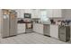 Well-equipped kitchen featuring granite counters and white cabinetry at 4291 Lamar St, Decatur, GA 30035